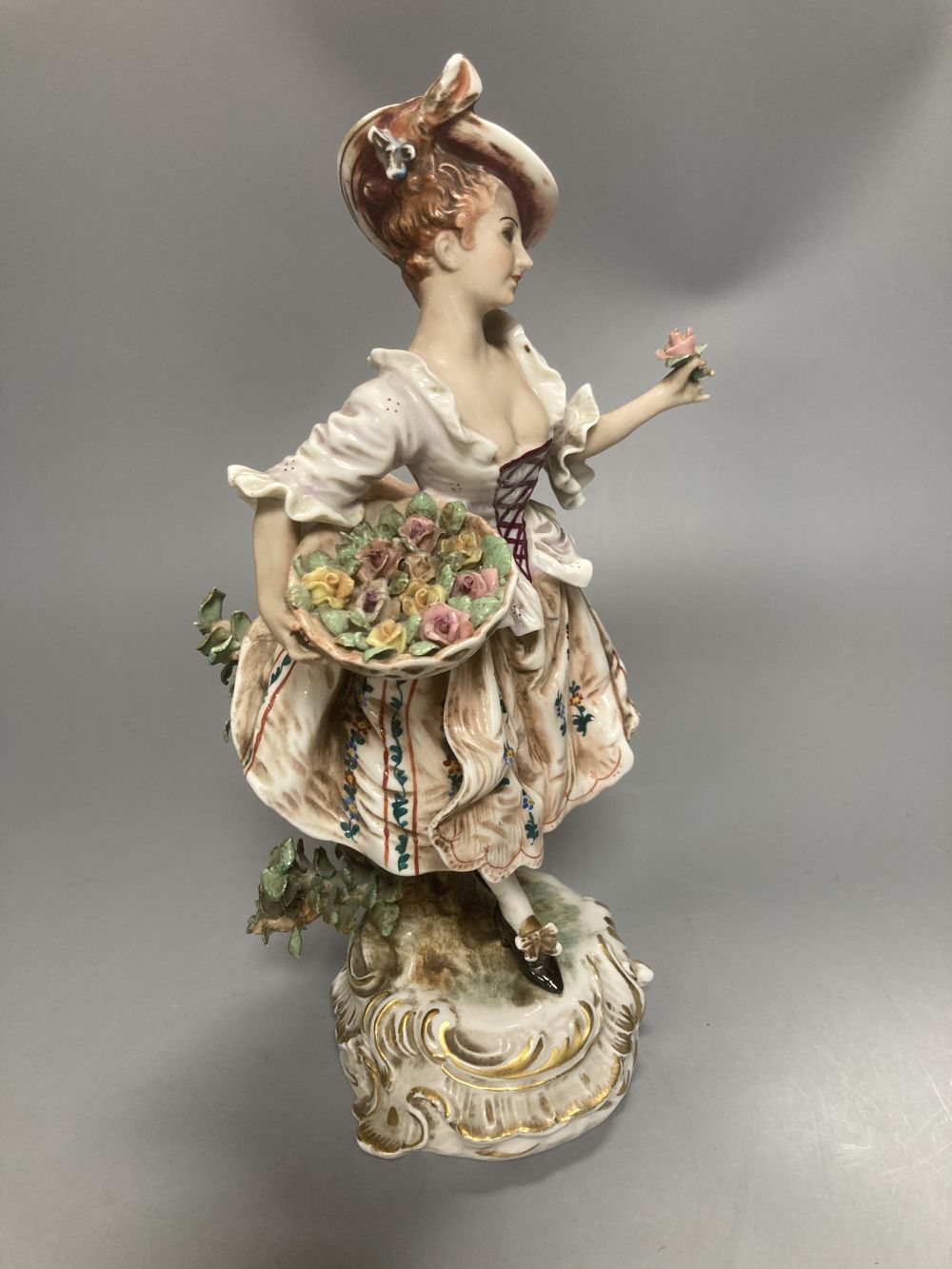 A pair of Wessel Frankenthal figures, 26cm, and a French bisque gallant, 29cm